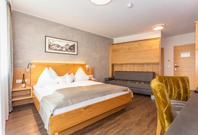 Zimmerbeispiel: Mehrbettzimmer Deluxe Balkon