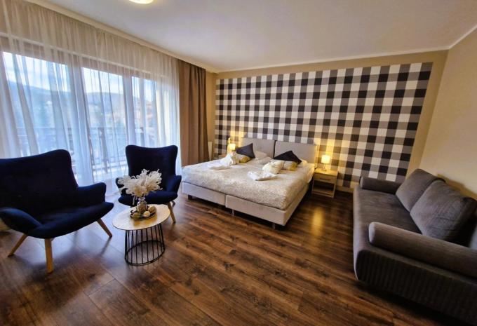 Zimmerbeispiel, Doppelzimmer Deluxe Balkon mit Schlafsofa