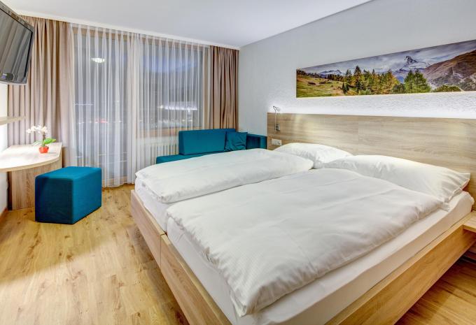 Beispiel Dreibettzimmer „Balkon Südseite“