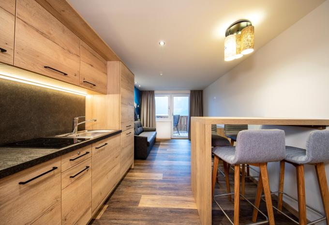 Zimmerbeispiel Deluxe Doppelzimmer Balkon "Alpenglück"