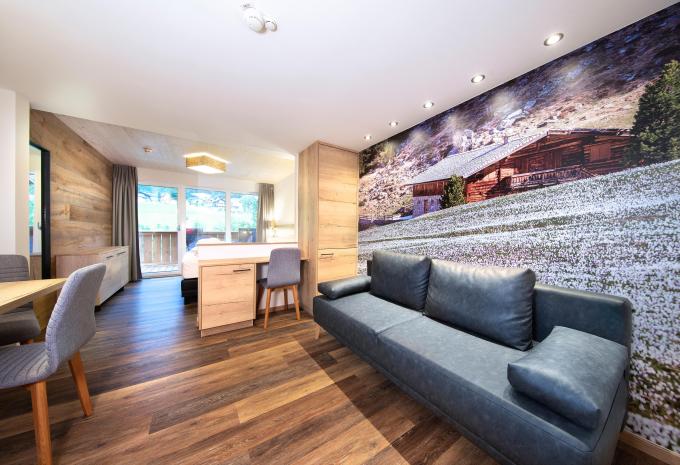 Zimmerbeispiel Deluxe Doppelzimmer Balkon "Wasserfallrausch"