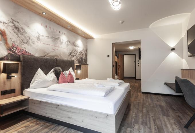 Zimmerbeispiel Comfort Vierbettzimmer Balkon